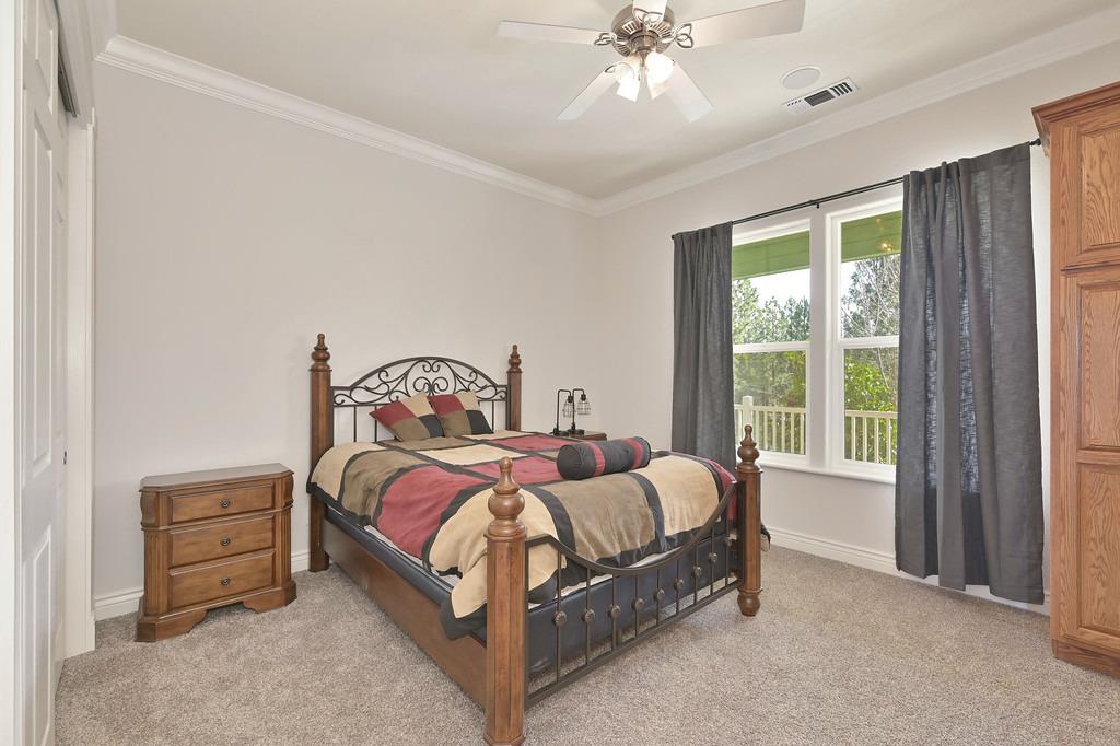 5901 Traverse Creek Road Garden Valley, CA 95633 - Photo 35 of 98 a bed sitting in a bedroom next to a window