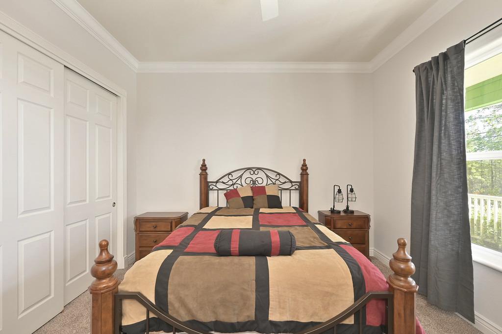 5901 Traverse Creek Road Garden Valley, CA 95633 - Photo 36 of 98 a bed sitting in a bedroom next to a window