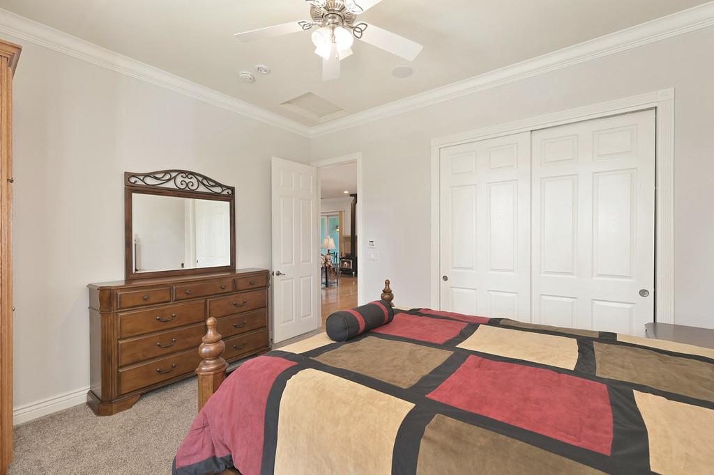 5901 Traverse Creek Road Garden Valley, CA 95633 - Photo 37 of 98 a bedroom with a bed and a dresser