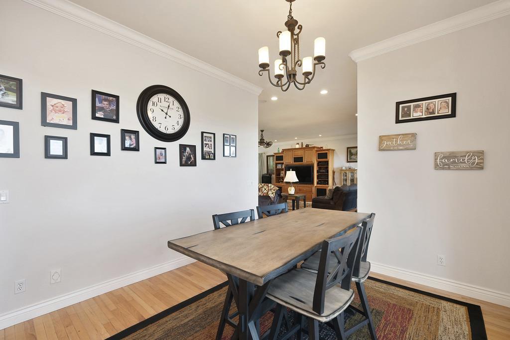 5901 Traverse Creek Road Garden Valley, CA 95633 - Photo 41 of 98 a view of a dining room with furniture and a chandelier
