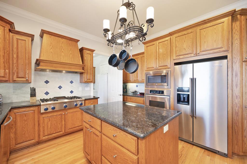 5901 Traverse Creek Road Garden Valley, CA 95633 - Photo 45 of 98 a kitchen with stainless steel appliances granite countertop a sink a stove and refrigerator