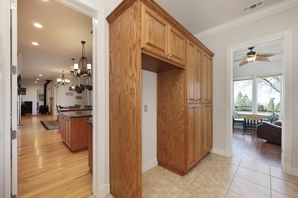 5901 Traverse Creek Road Garden Valley, CA 95633 - Photo 50 of 98 hallway with suspended lighting and crown molding