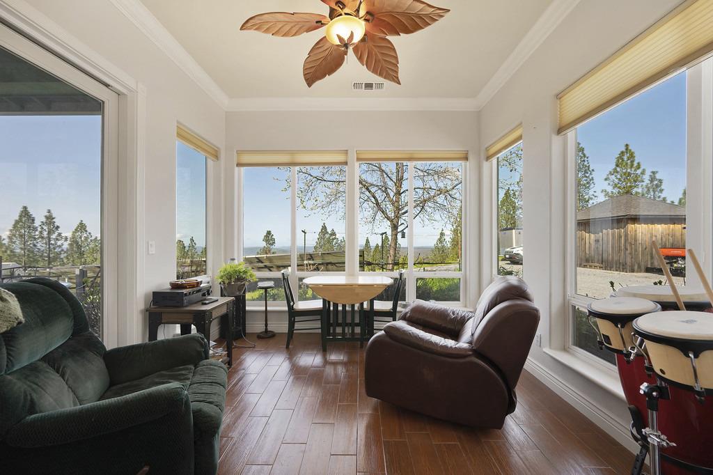 5901 Traverse Creek Road Garden Valley, CA 95633 - Photo 52 of 98 sunroom featuring wood finished floors, crown molding, and plenty of natural light