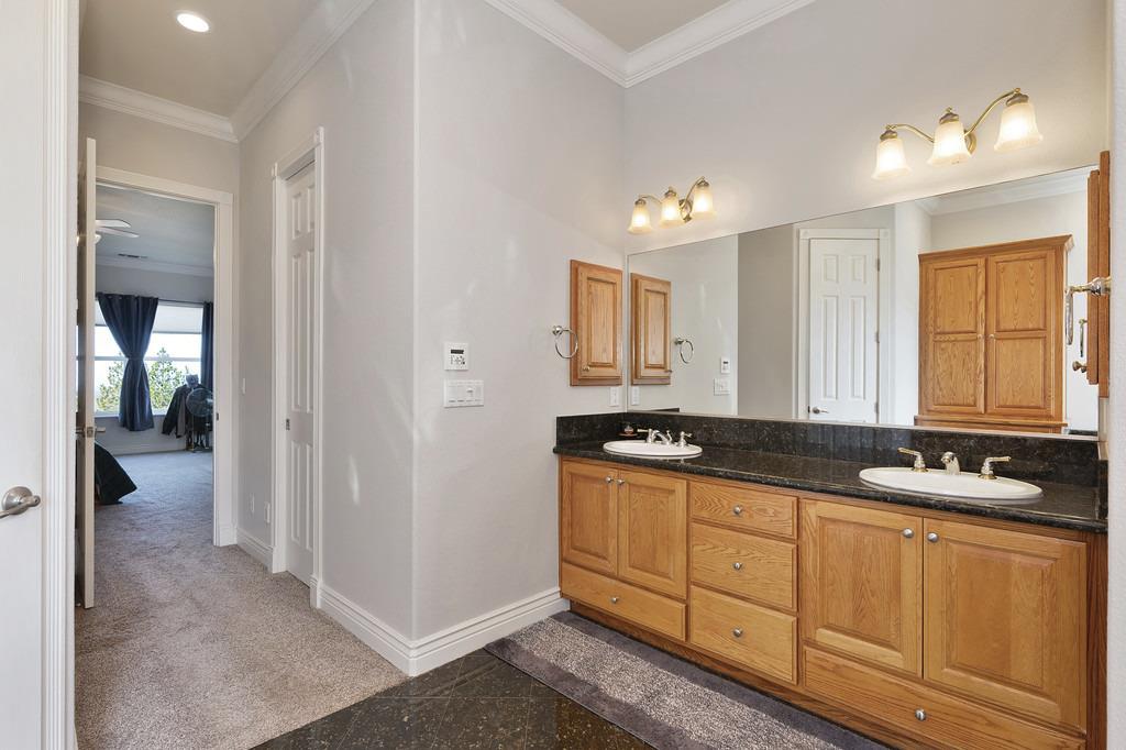 5901 Traverse Creek Road Garden Valley, CA 95633 - Photo 63 of 98 a kitchen with granite countertop a sink a stove cabinets and a window