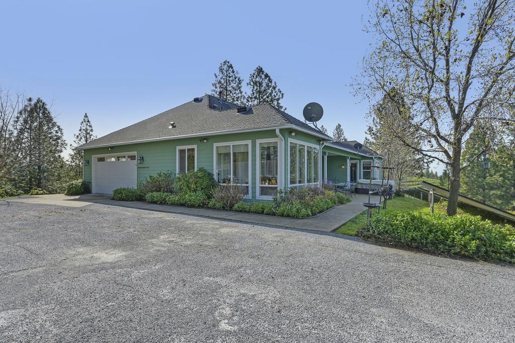 5901 Traverse Creek Road Garden Valley, CA 95633 - Photo 65 of 98 a view of a house with a yard and potted plants