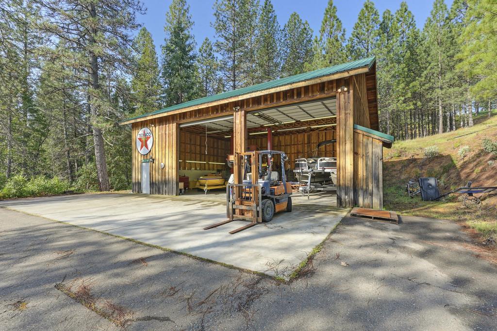 5901 Traverse Creek Road Garden Valley, CA 95633 - Photo 76 of 98 a view of a car park in front of a house with wooden fence