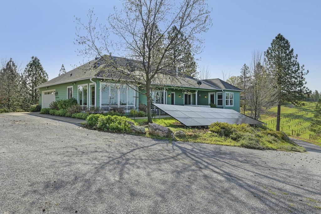 5901 Traverse Creek Road Garden Valley, CA 95633 - Photo 84 of 98 ranch-style house with a garage, asphalt driveway, and a patio