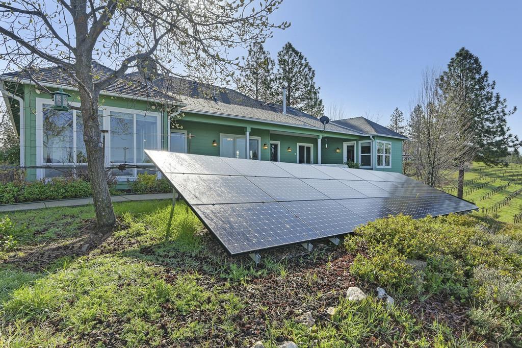 5901 Traverse Creek Road Garden Valley, CA 95633 - Photo 85 of 98 back of house with ground mounted solar panels