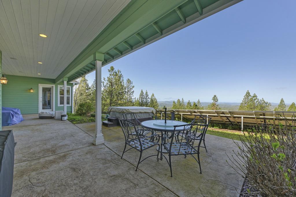 5901 Traverse Creek Road Garden Valley, CA 95633 - Photo 89 of 98 view of patio with outdoor dining area and a hot tub