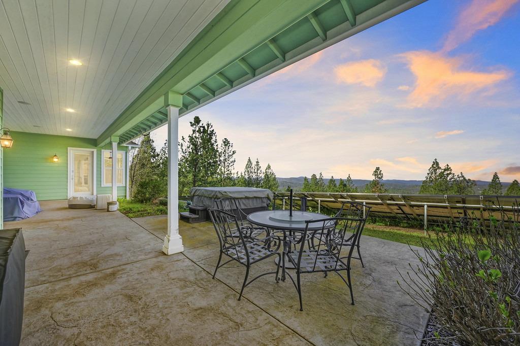 5901 Traverse Creek Road Garden Valley, CA 95633 - Photo 90 of 98 view of patio with outdoor dining space, a jacuzzi, and a grill