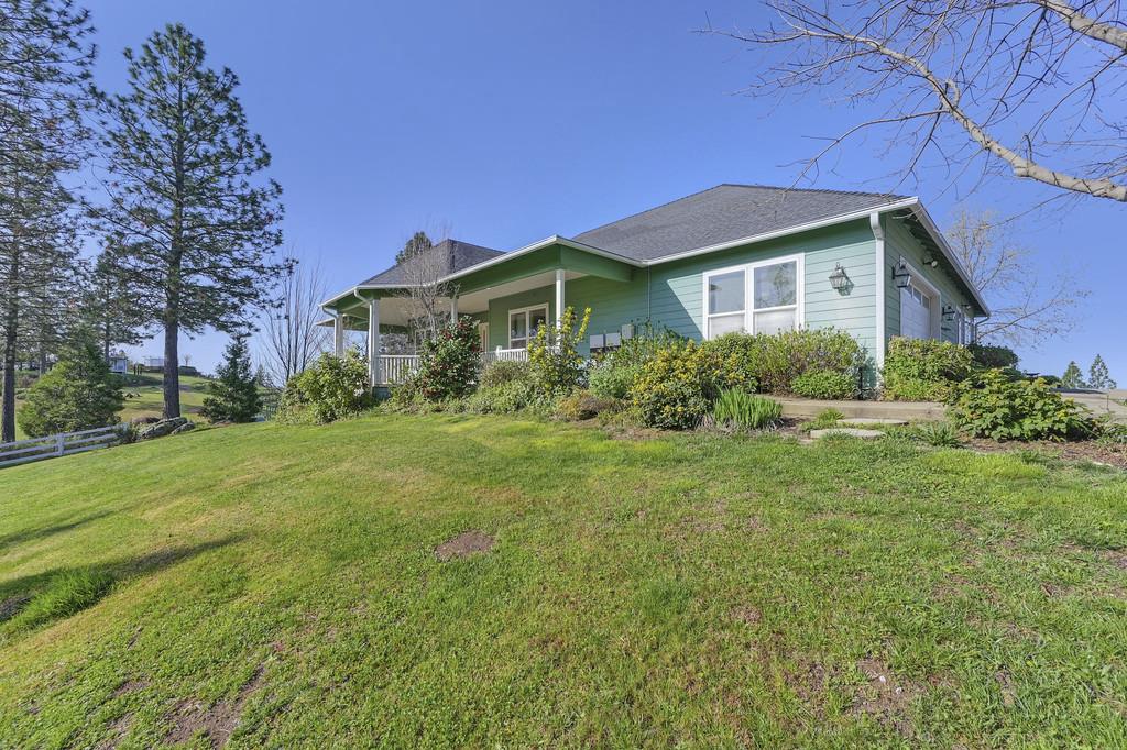 5901 Traverse Creek Road Garden Valley, CA 95633 - Photo 9 of 98 view of front facade featuring a front lawn and a porch