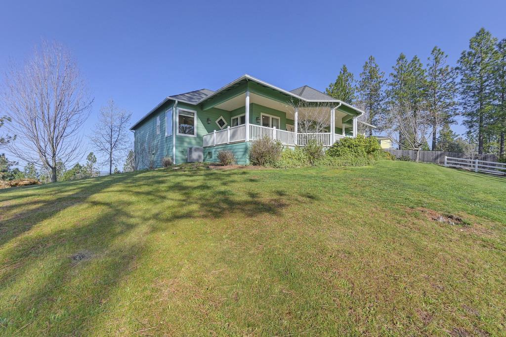 5901 Traverse Creek Road Garden Valley, CA 95633 - Photo 10 of 98 a front view of a house with a yard