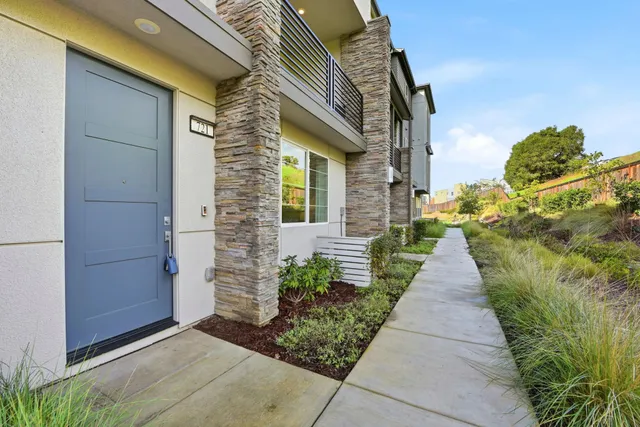 a view of a pathway both side of house