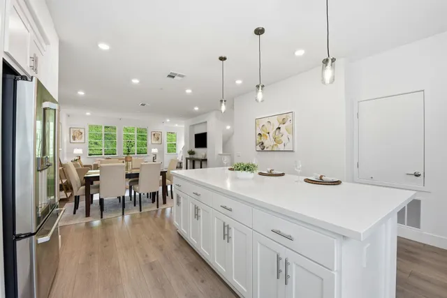 a view of a kitchen and dining room