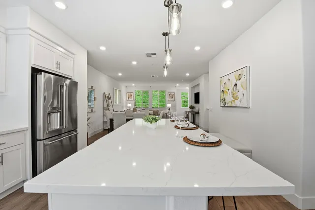 a white toilet sitting next to a bathroom sink