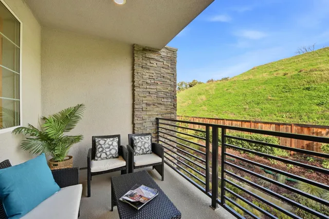 a view of a balcony with an outdoor space