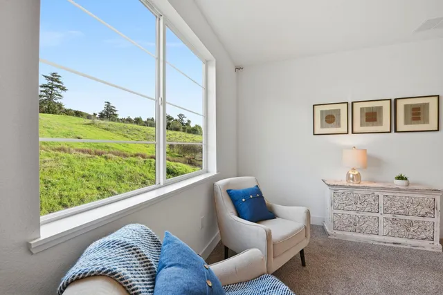 a bedroom with bed and a window