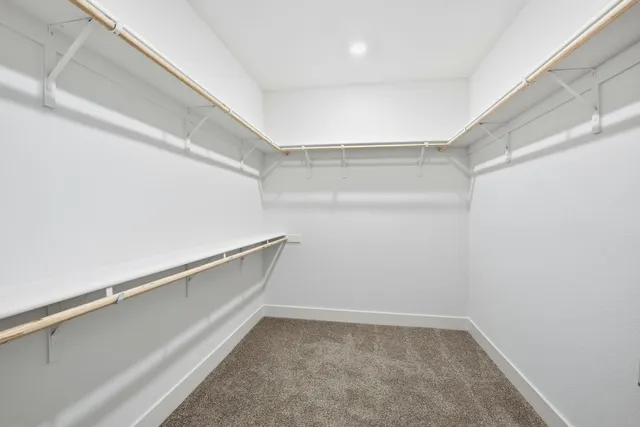 a bathroom with a shower sink vanity granite and mirror
