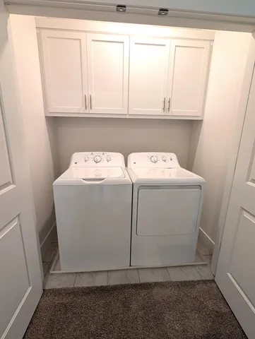 a view of empty room with wooden walls