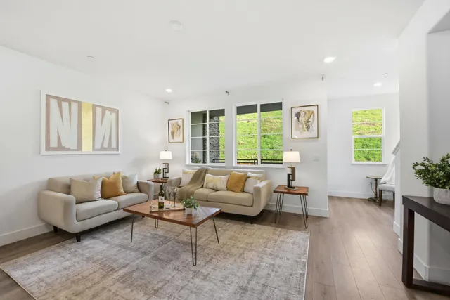 a living room with furniture and windows