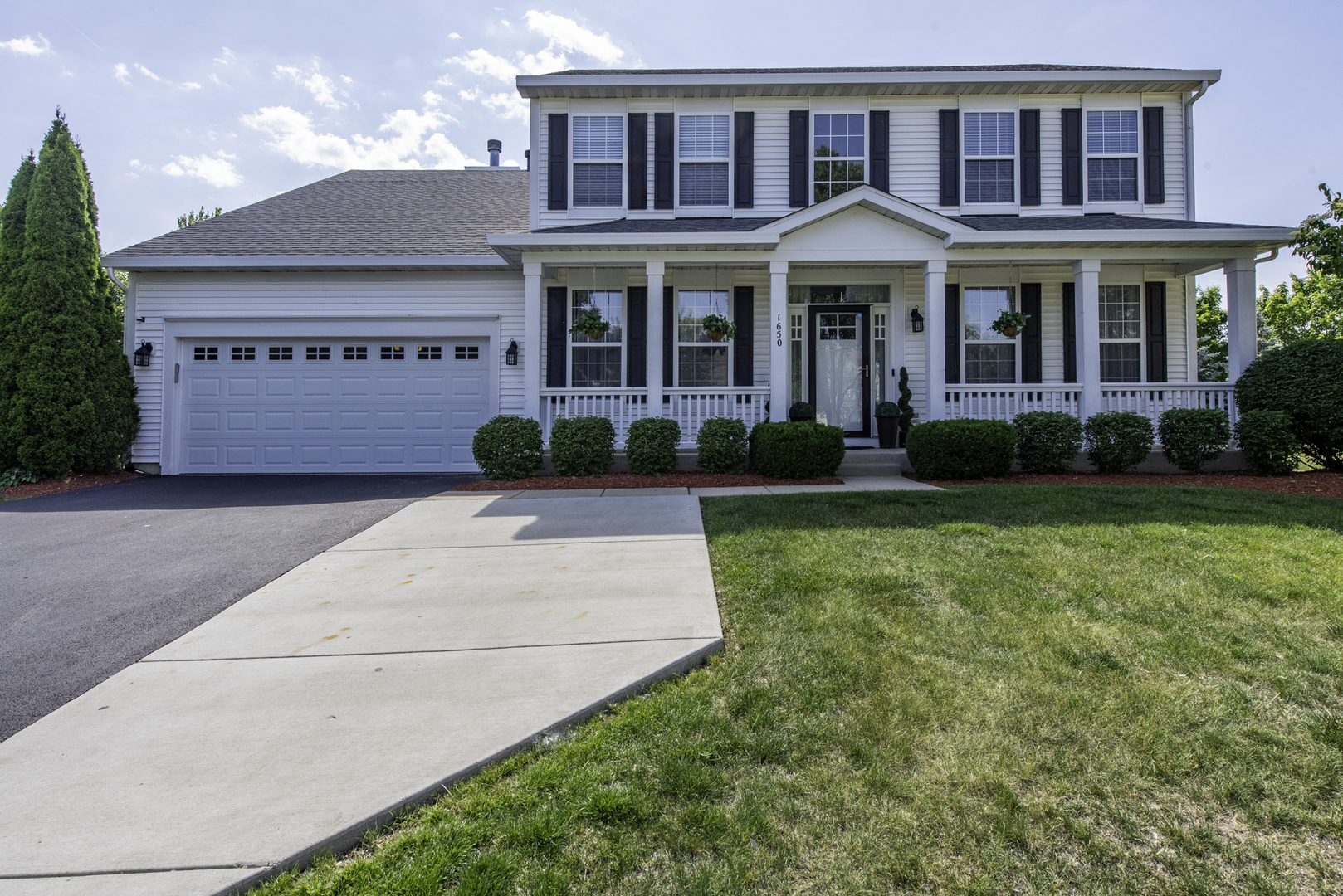 1650 Natures Way Lindenhurst, IL 60046 - Photo 1 of 55 a front view of a house with garden
