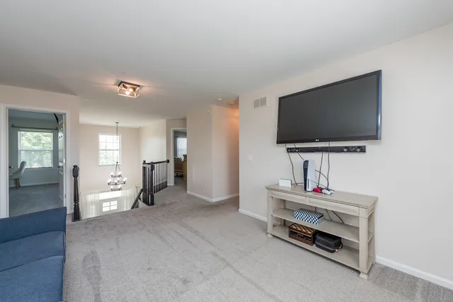 a bathroom with a sink toilet and a mirror