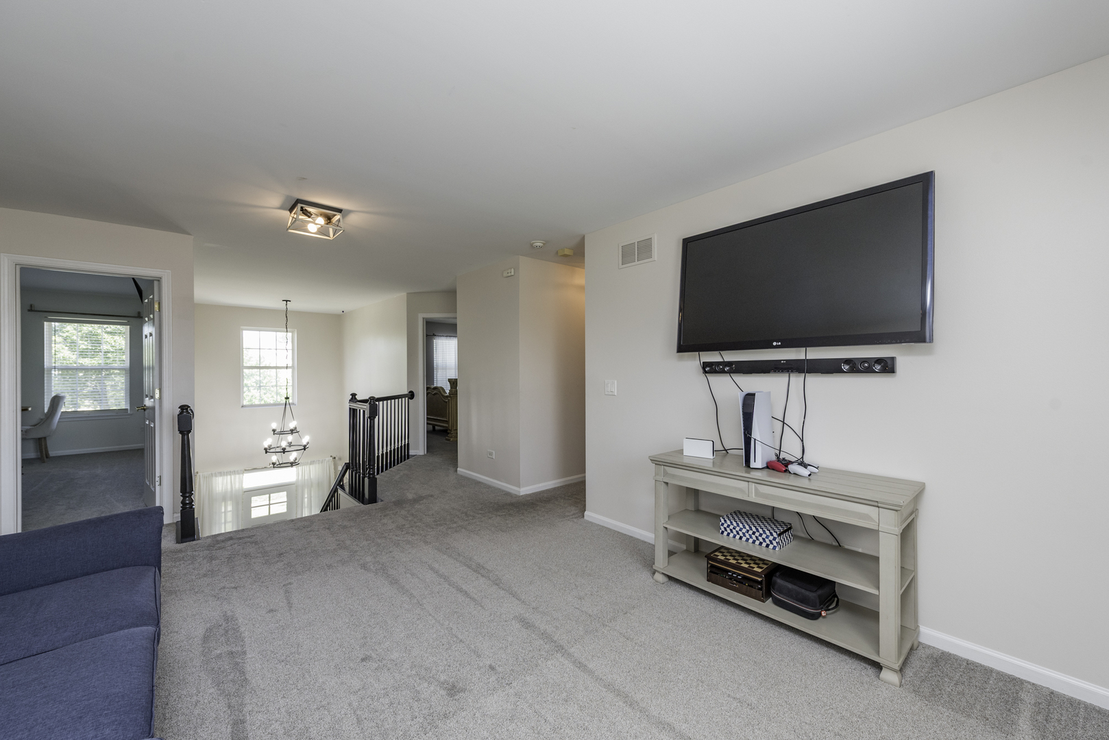 1650 Natures Way Lindenhurst, IL 60046 - Photo 30 of 55 a living room with furniture and a flat screen tv