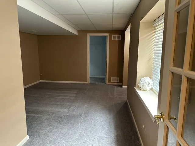 a front view of house with yard and outdoor seating