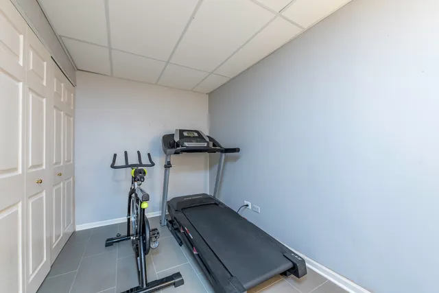 a view of a patio with table and chairs and potted plants