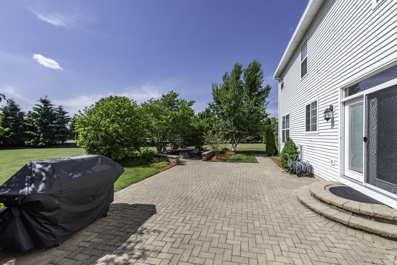 1650 Natures Way Lindenhurst, IL 60046 - Photo 42 of 55 a view of a porch with furniture and a yard