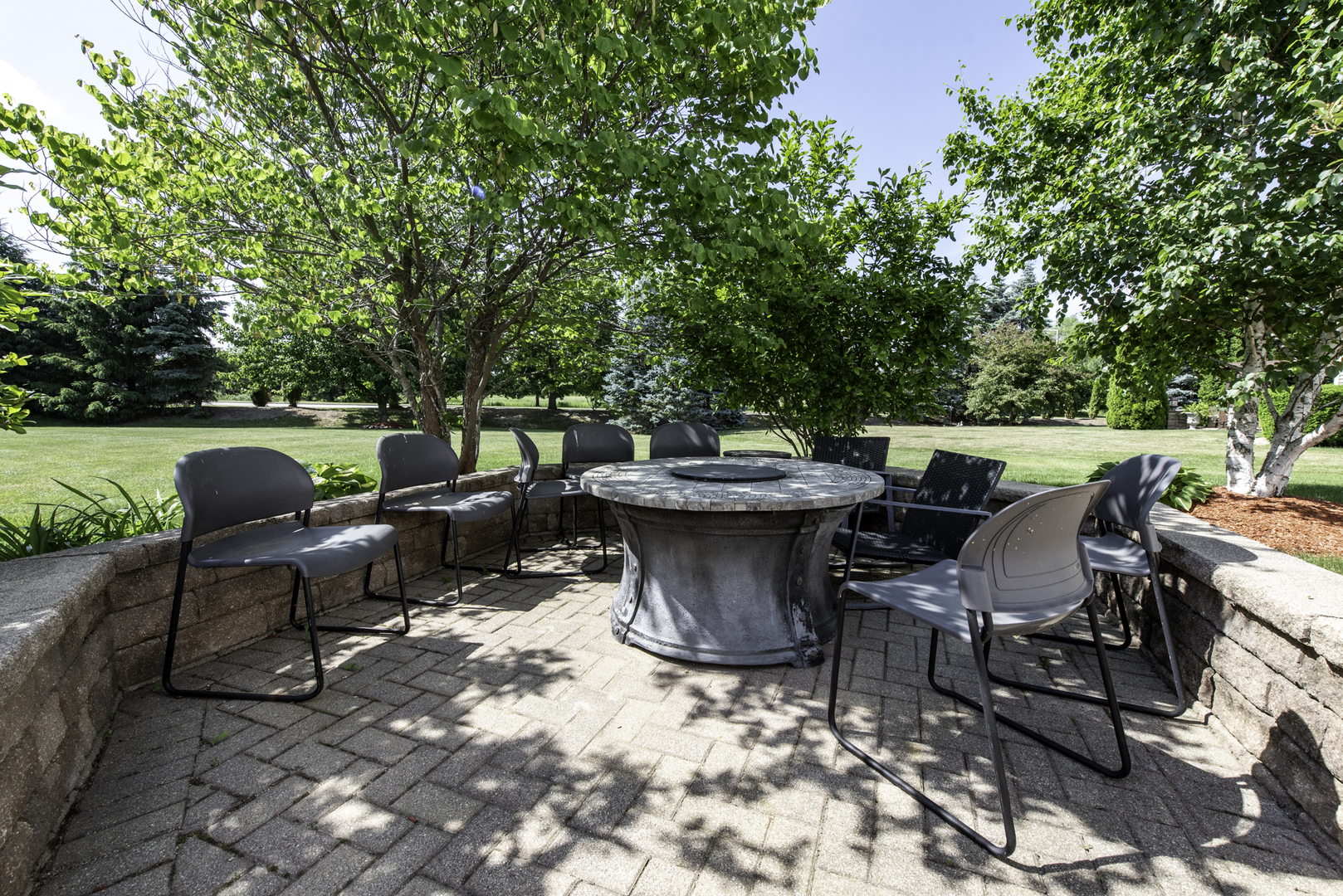 1650 Natures Way Lindenhurst, IL 60046 - Photo 44 of 55 a view of a patio with table and chairs and potted plants