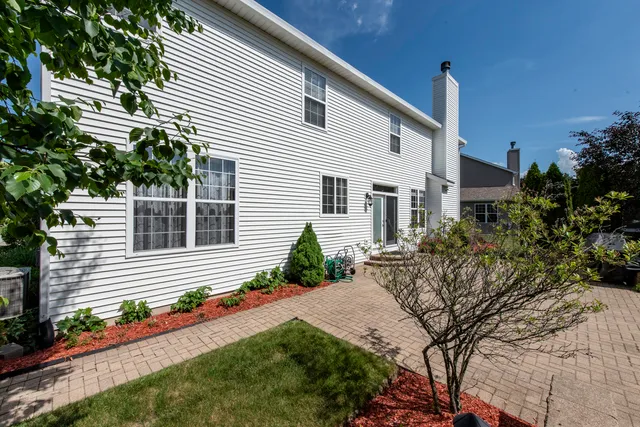 a view of a house with a small yard