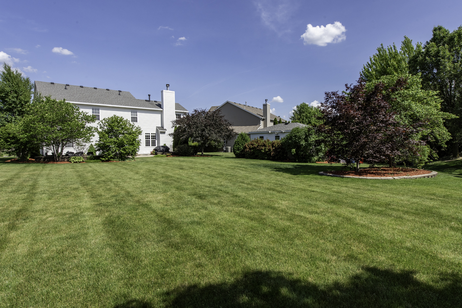 1650 Natures Way Lindenhurst, IL 60046 - Photo 54 of 55 a view of a garden with a building in the background