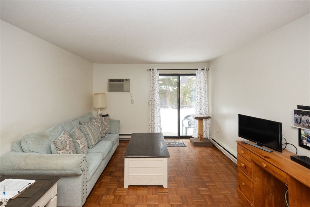 1195 Grafton Street, Unit 19 Worcester, MA 01604 - Photo 4 of 22 a living room with furniture and a flat screen tv