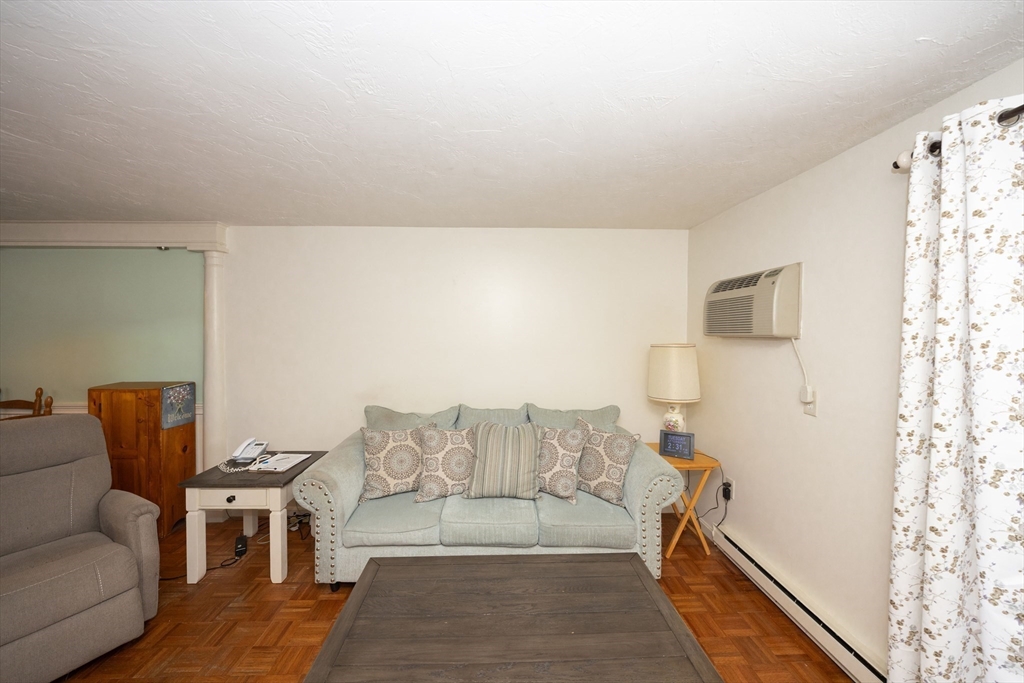 1195 Grafton Street, Unit 19 Worcester, MA 01604 - Photo 5 of 22 a living room with furniture and a couch