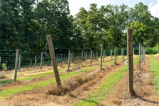 a view of a car park in front of a house