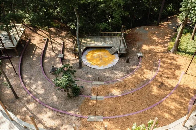 a view of a kitchen with furniture and wooden floor