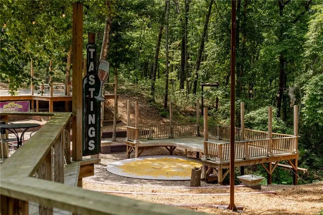 a kitchen with stainless steel appliances granite countertop a stove a refrigerator and a kitchen island