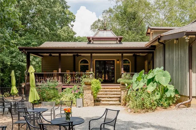 a view of a wooden chairs in a balcony
