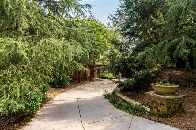 a view of a swimming pool with a yard