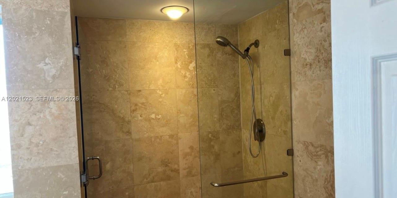 9159 Southwest 77th Avenue, Unit 101 Miami, FL 33156 - Photo 6 of 12 a bathroom with a shower