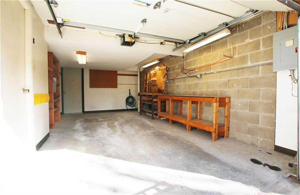 105 Rossmor Court Pittsburgh, PA 15229 - Photo 22 of 24 Well Lit Garage With Work Benches
