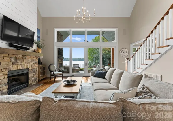 a living room with furniture fireplace and flat screen tv