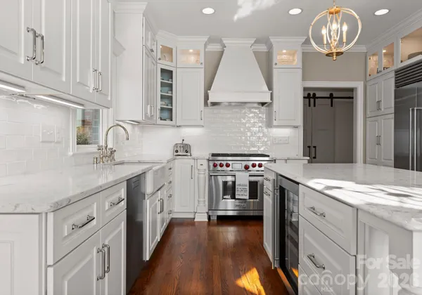 a kitchen with cabinets and appliances