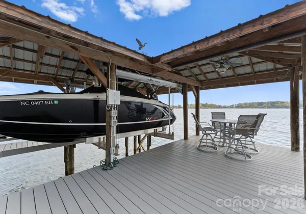 a view of a chairs and table on the deck