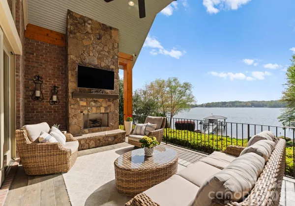 a living room with fireplace furniture and a flat screen tv