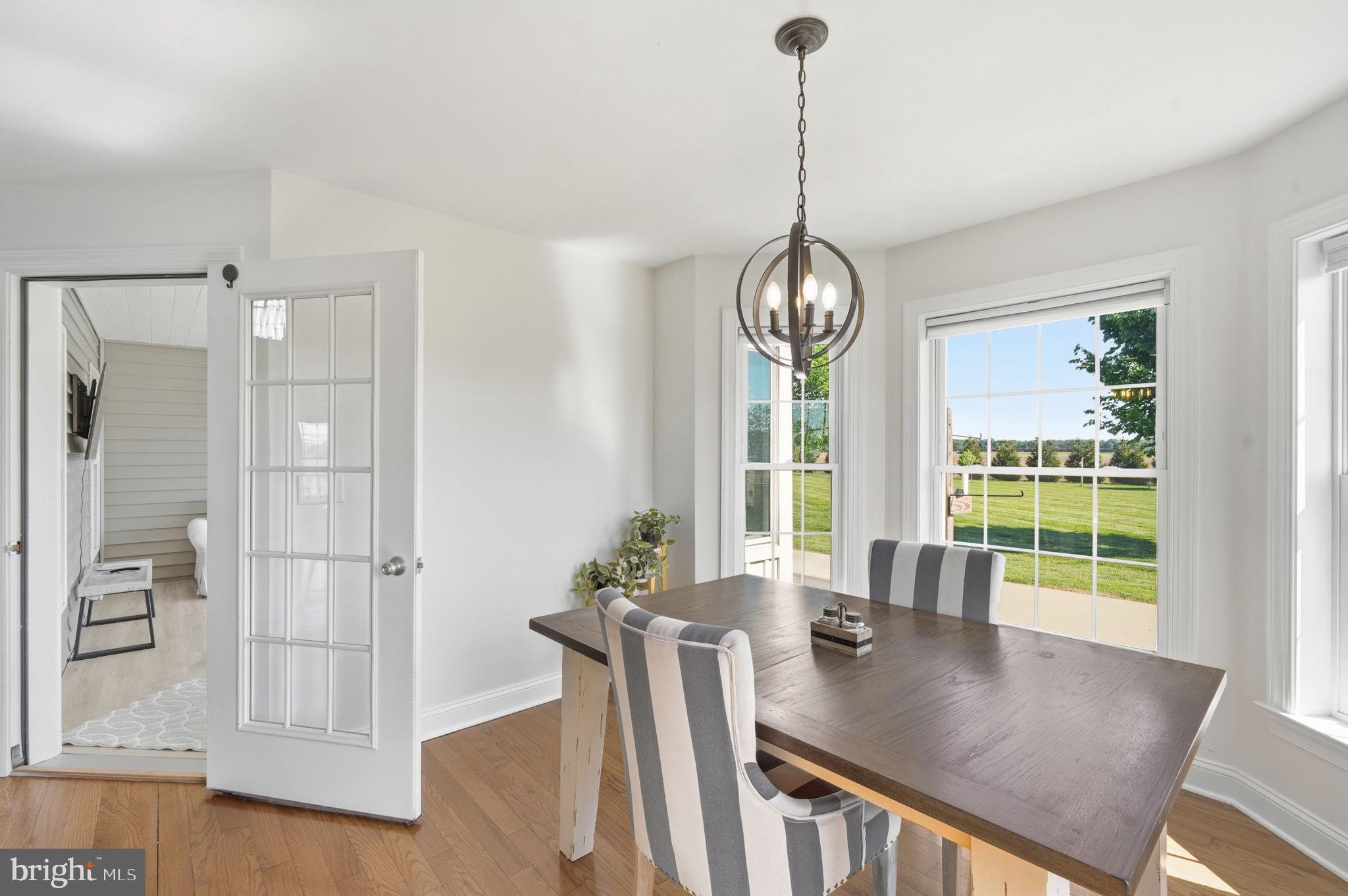 615 Ell Downes Road Henderson, MD 21640 - Photo 10 of 58 Bright dining space with scenic views.