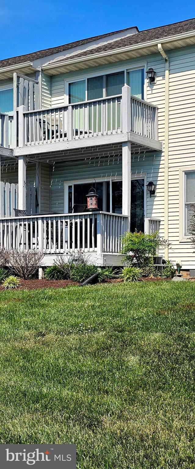 106 Bodys Neck Road Chester, MD 21619 - Photo 4 of 17 a front view of a house with a garden