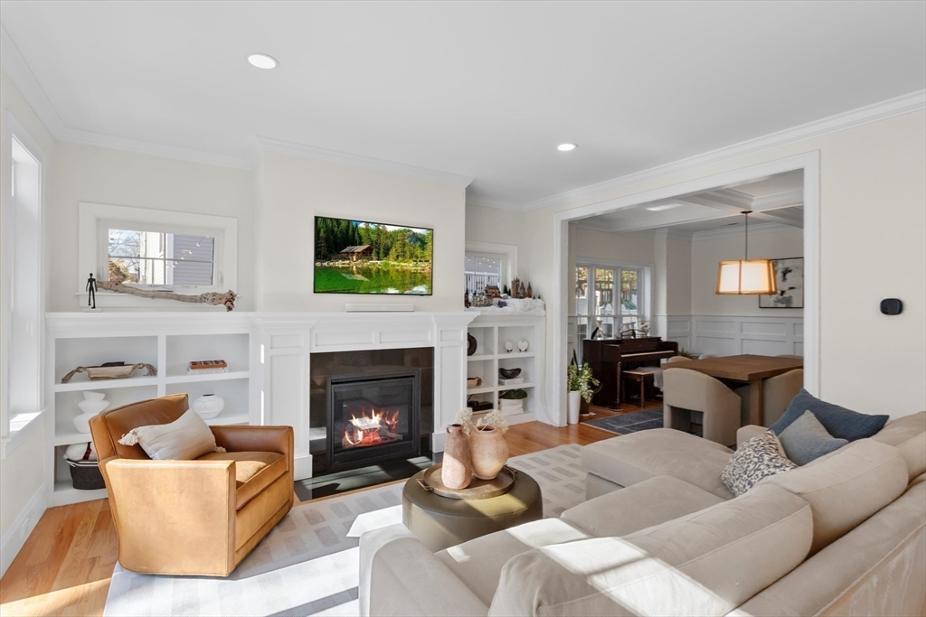 96 Winchester Road Arlington, MA 02474 - Photo 11 of 34 a living room with furniture and a fireplace