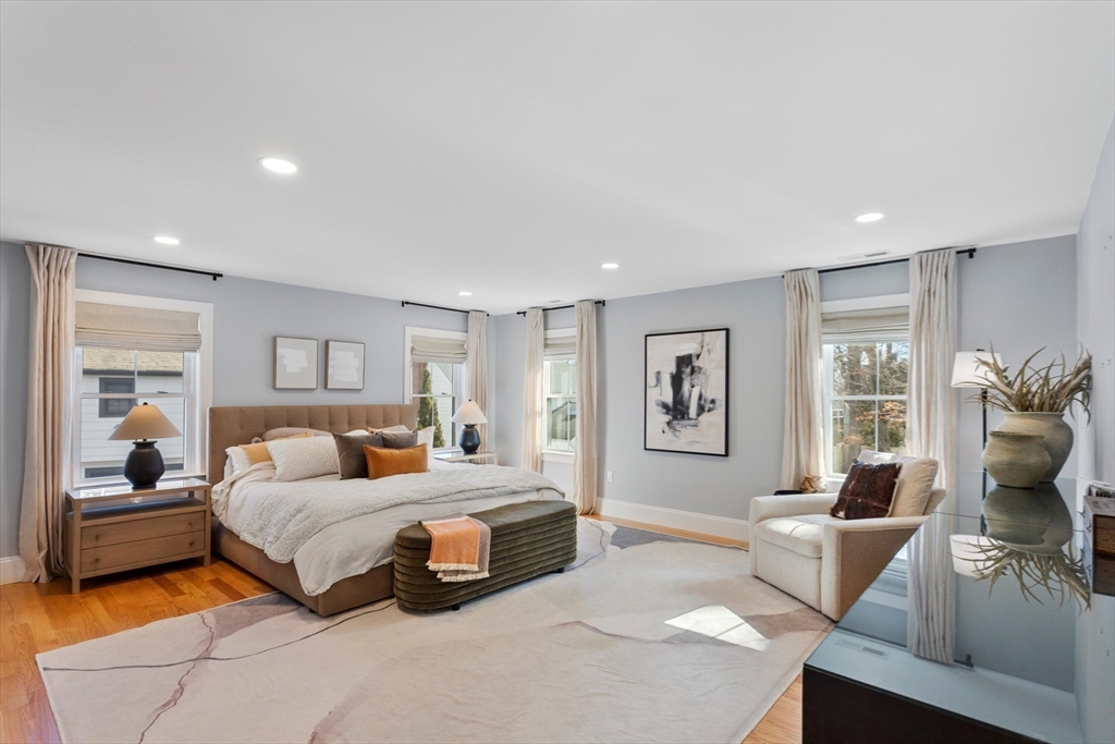 96 Winchester Road Arlington, MA 02474 - Photo 15 of 34 a bedroom with a large bed and a couch